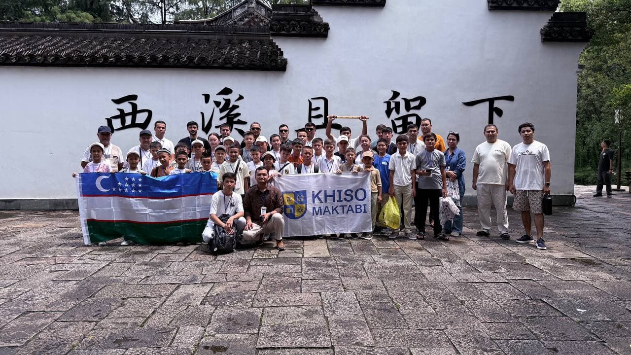 Participants outside the campus buildings between sessions